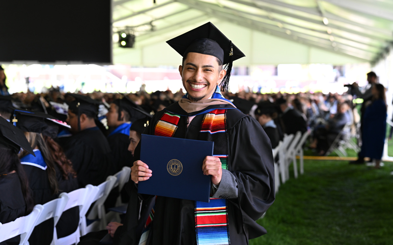 Graduating student in cap and gown.